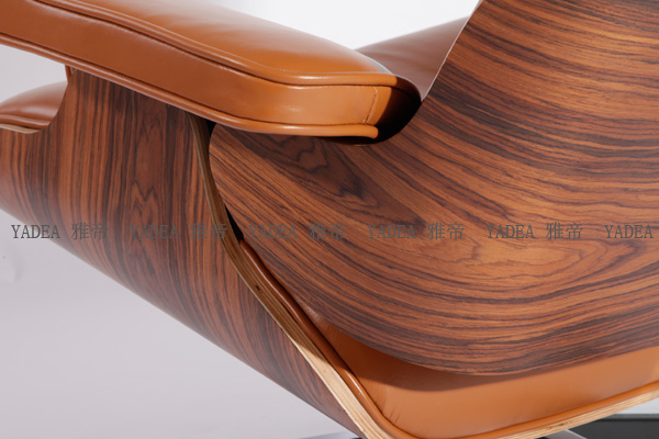 橙色核桃木贴皮的伊姆斯休闲椅(Walnut Eames Lounge Chair In Orange Leather)